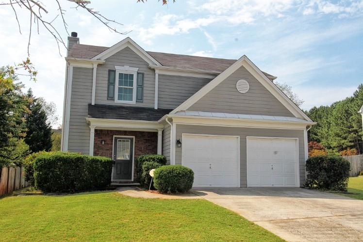 11700 Bentham Court Alpharetta, GA 30005 - Photo 1 of 21 a front view of a house with a yard