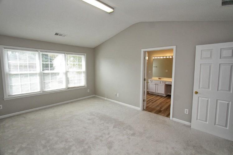 11700 Bentham Court Alpharetta, GA 30005 - Photo 12 of 21 an empty room with windows and bathroom view