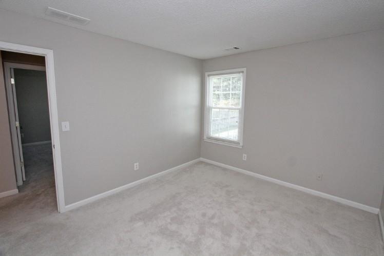 11700 Bentham Court Alpharetta, GA 30005 - Photo 15 of 21 an empty room with windows and closet