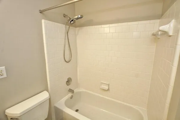 a view of an empty room and closet area