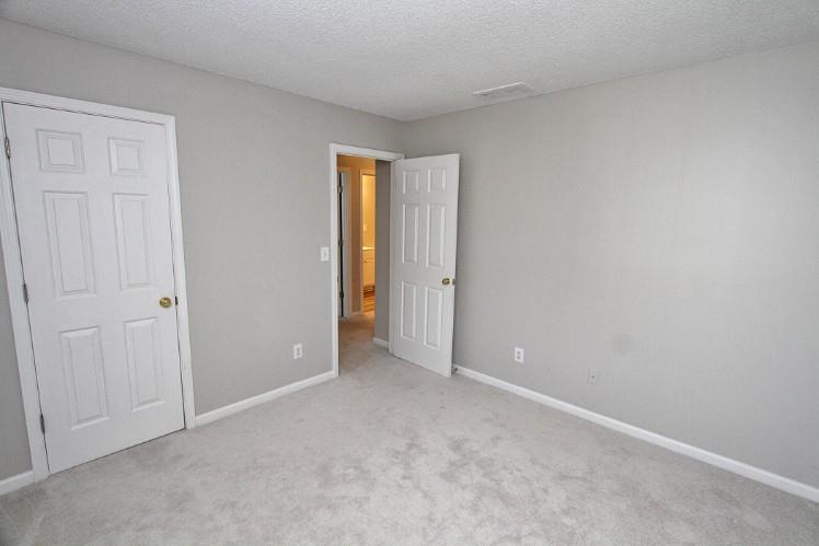 11700 Bentham Court Alpharetta, GA 30005 - Photo 19 of 21 a view of an empty room and closet area