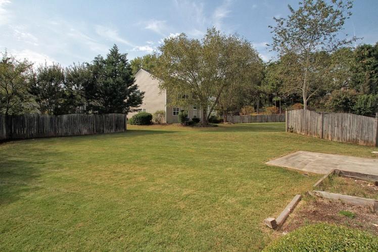 11700 Bentham Court Alpharetta, GA 30005 - Photo 21 of 21 a view of a swimming pool with a yard