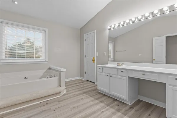 a view of hallway with wooden floor