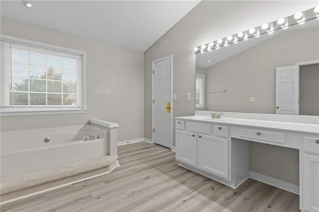 a view of hallway with wooden floor