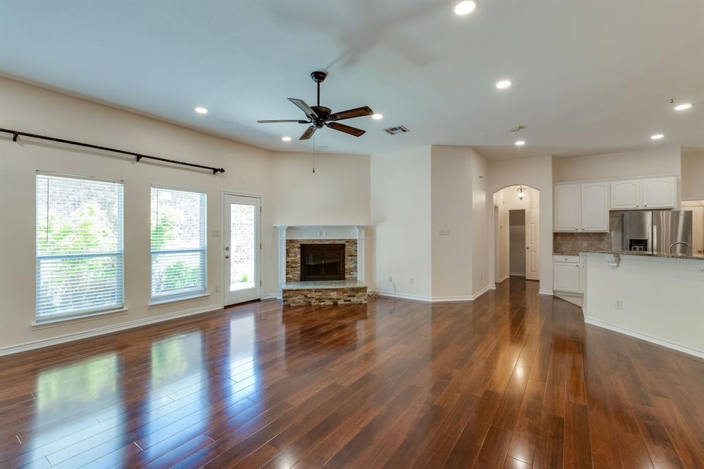 7728 Lancaster Gate Frisco, TX 75035 - Photo 13 of 30 a view of an empty room with wooden floor and a window