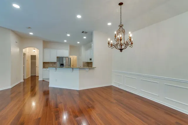 a view of kitchen with cabinets and wooden floor