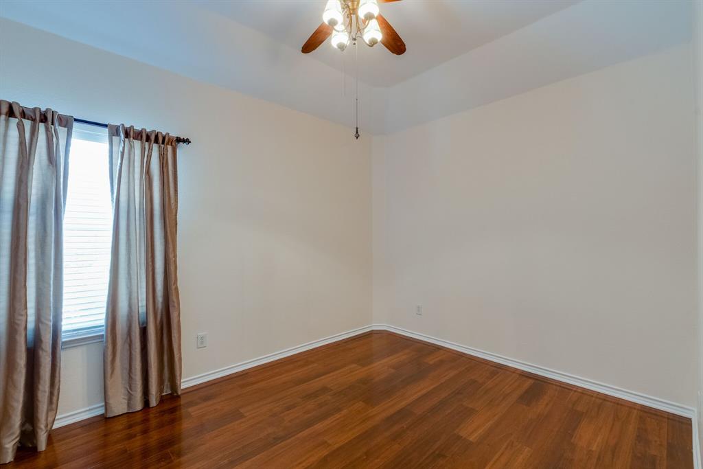 7728 Lancaster Gate Frisco, TX 75035 - Photo 24 of 30 a view of empty room with wooden floor and fan