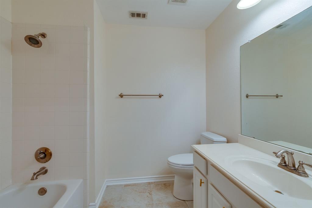 7728 Lancaster Gate Frisco, TX 75035 - Photo 25 of 30 a bathroom with a sink a toilet and shower