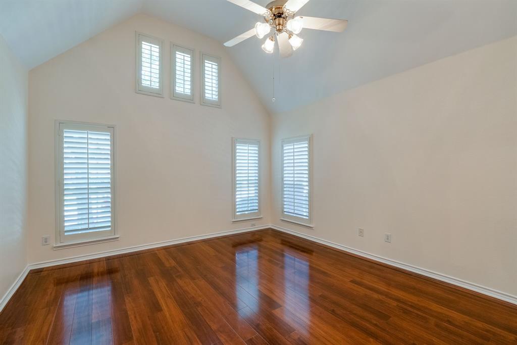 7728 Lancaster Gate Frisco, TX 75035 - Photo 6 of 30 a view of an empty room with wooden floor and a window