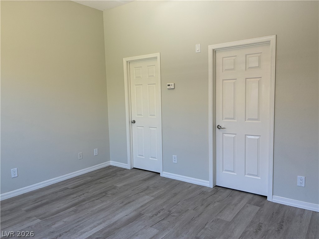 10 Caprington Road Henderson, NV 89052 - Photo 38 of 44 Newly finished room boasts a neutral palette and durable plank flooring.