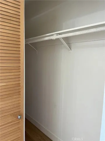 a white toilet sitting next to a bath tub and shower