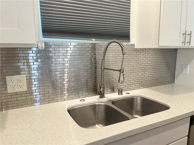 a kitchen with a sink and a bathtub