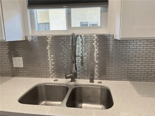 a view of a sink and a window