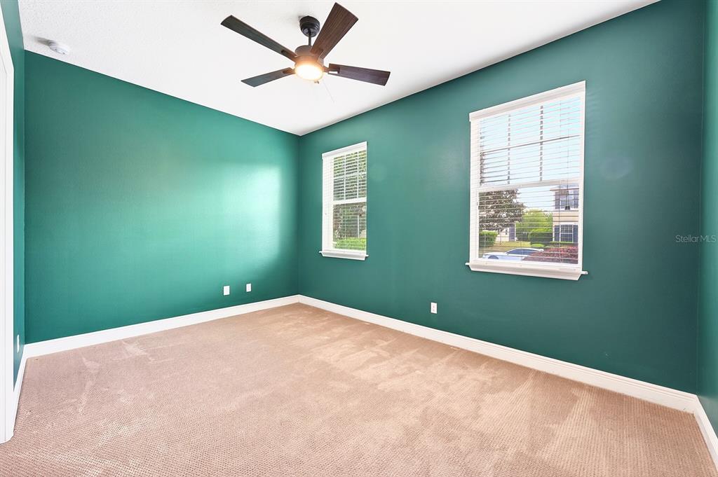 918 Seburn Road Apopka, FL 32703 - Photo 19 of 34 a view of a big room with windows and ceiling fan