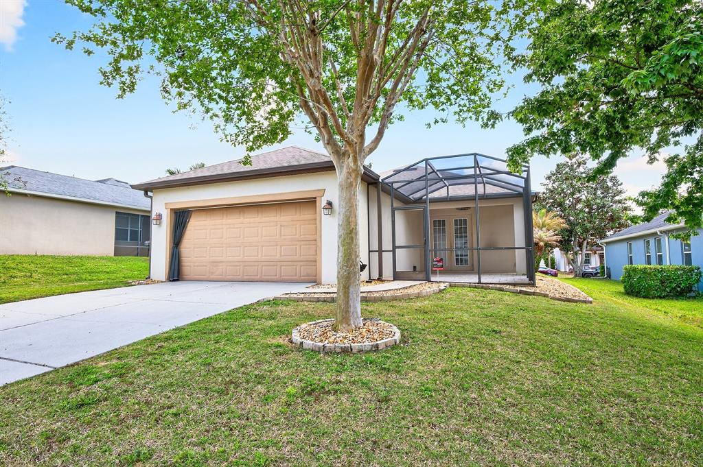 918 Seburn Road Apopka, FL 32703 - Photo 26 of 34 a front view of a house with a yard and garage