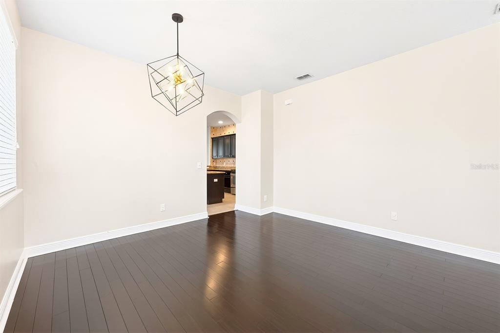 918 Seburn Road Apopka, FL 32703 - Photo 4 of 34 a view of a room with wooden floor