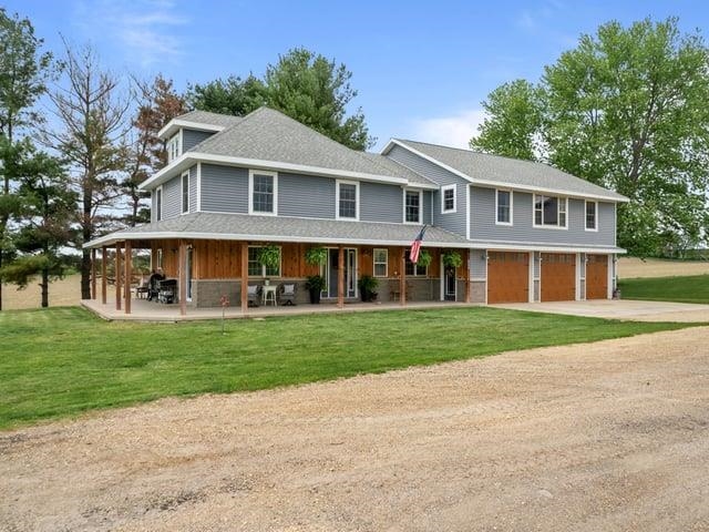 8294 North Leaf River Road Leaf River, IL 61047 - Photo 46 of 56 a front view of a house with a yard