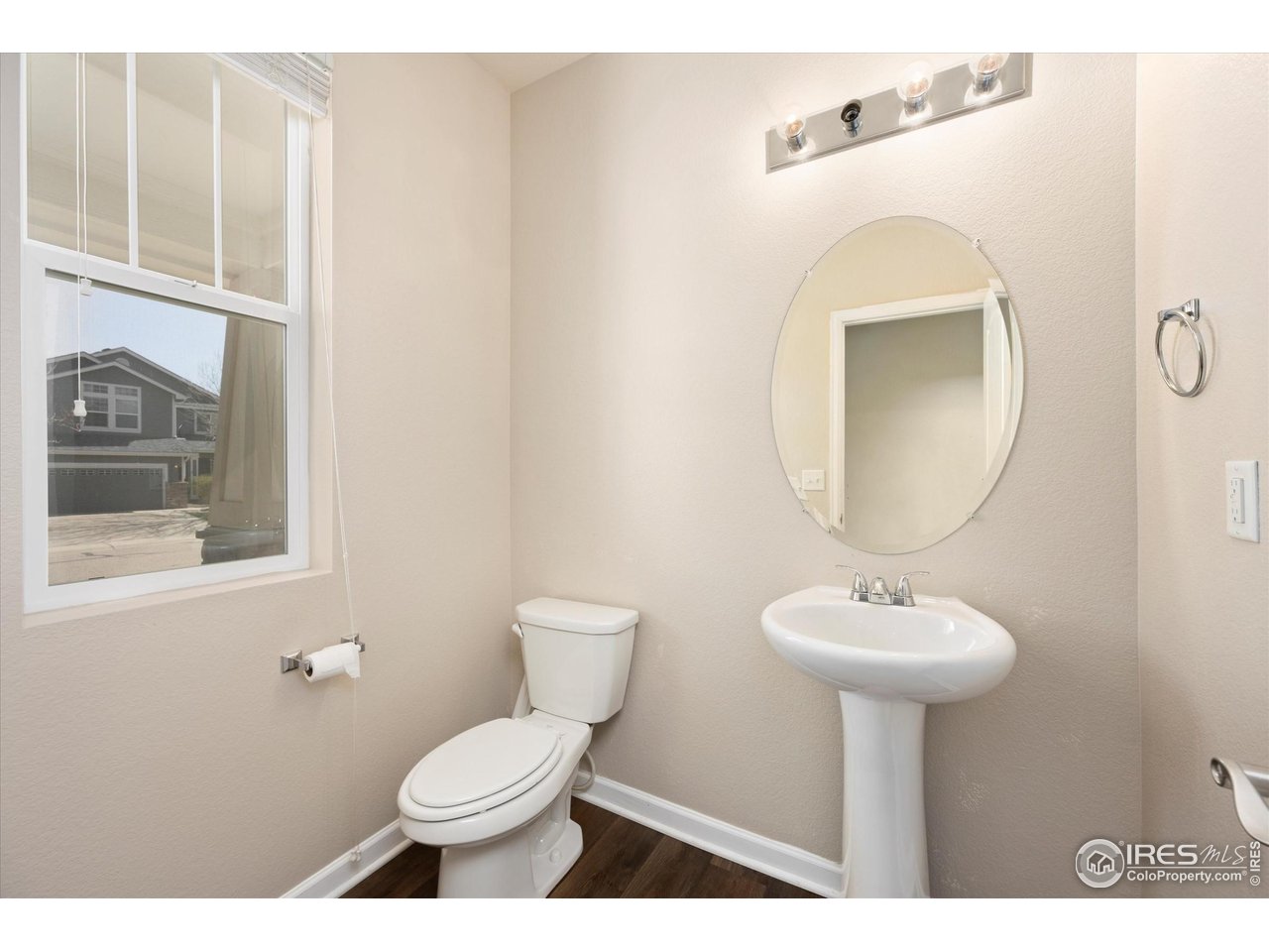 4874 Sandy Ridge Avenue Firestone, CO 80504 - Photo 12 of 35 a bathroom with a toilet sink and mirror