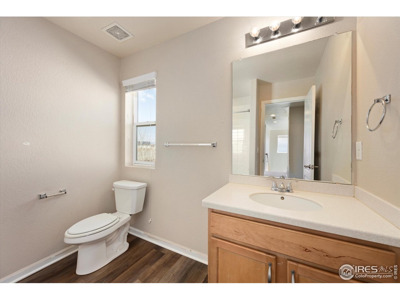 4874 Sandy Ridge Avenue Firestone, CO 80504 - Photo 24 of 35 a bathroom with a sink toilet a mirror and shower
