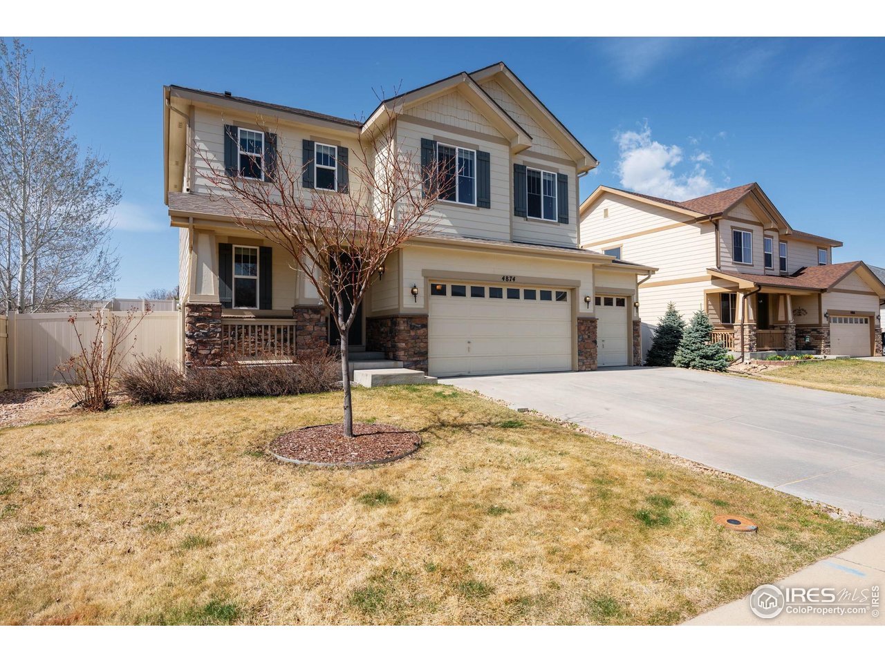 4874 Sandy Ridge Avenue Firestone, CO 80504 - Photo 3 of 35 a front view of a house with a yard