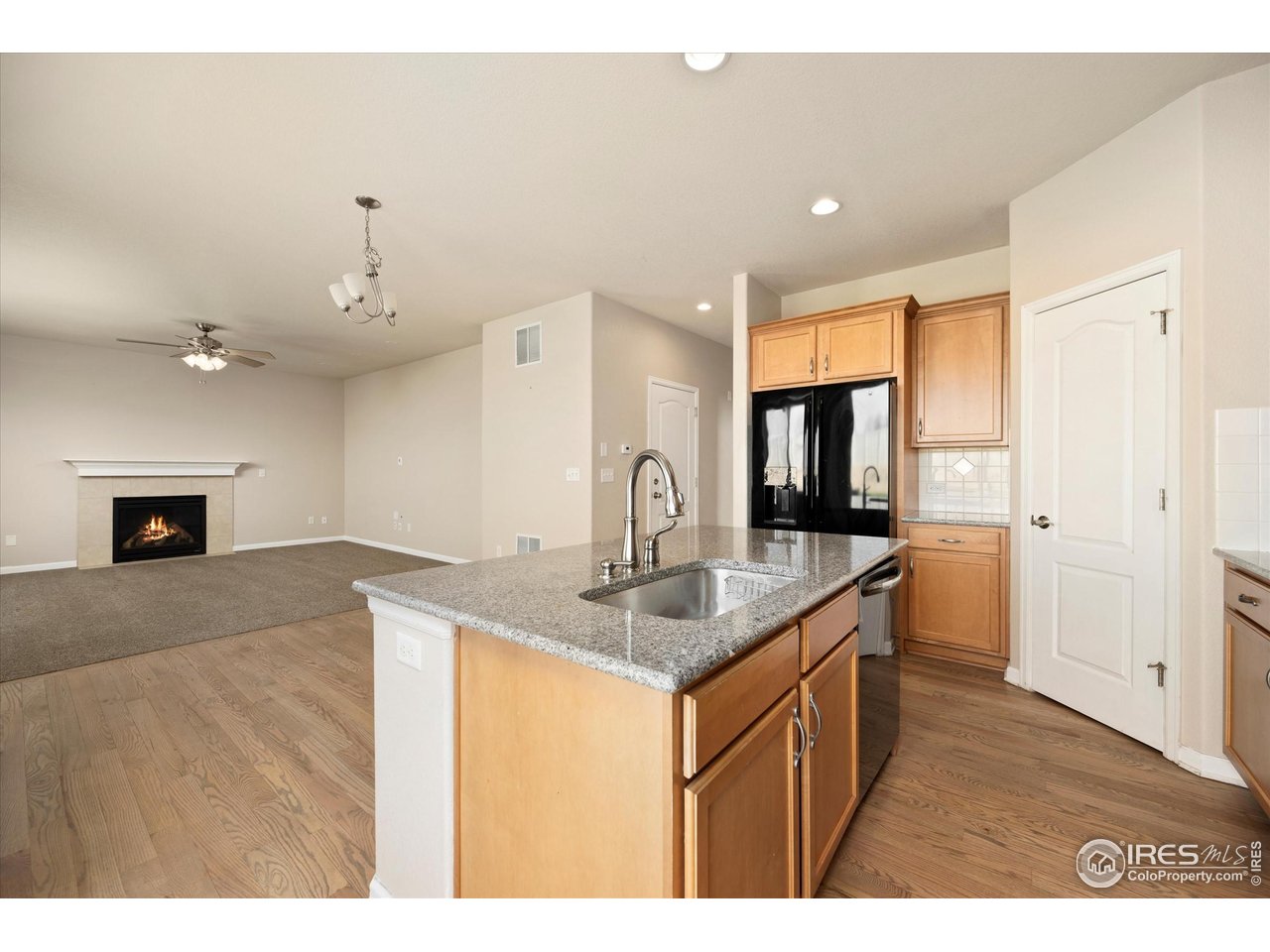 4874 Sandy Ridge Avenue Firestone, CO 80504 - Photo 5 of 35 a kitchen with sink and cabinets
