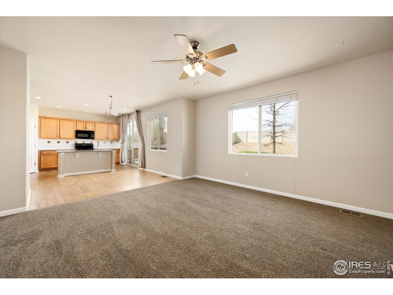 4874 Sandy Ridge Avenue Firestone, CO 80504 - Photo 9 of 35 a view of an empty room with a window