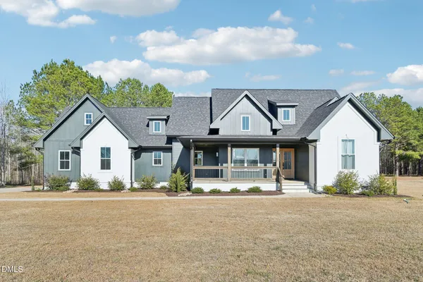 a front view of a house with a porch