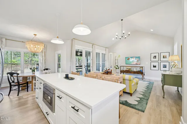 a view of a living room and kitchen