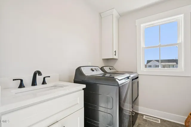 a kitchen with a stove and a sink