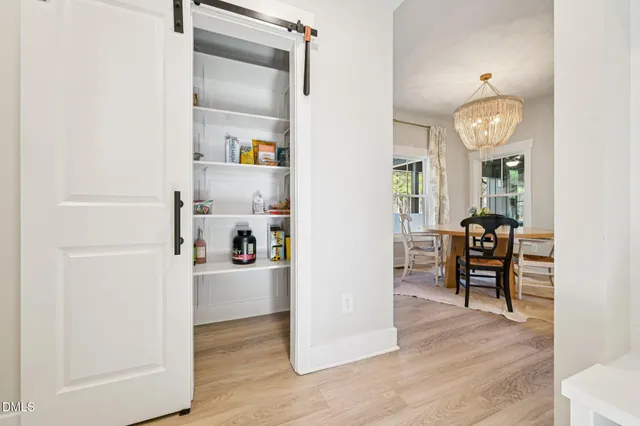 a view of a livingroom with furniture and wooden floor