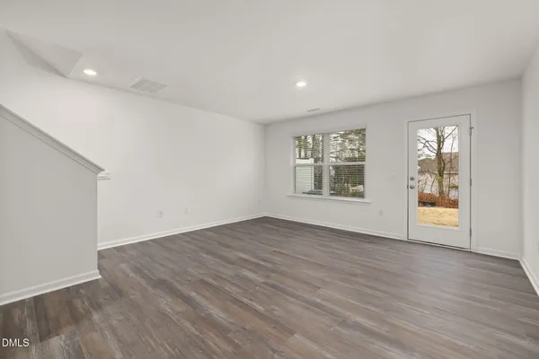 a view of an empty room and a window