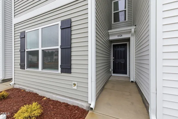 a view of a house with a door and a window
