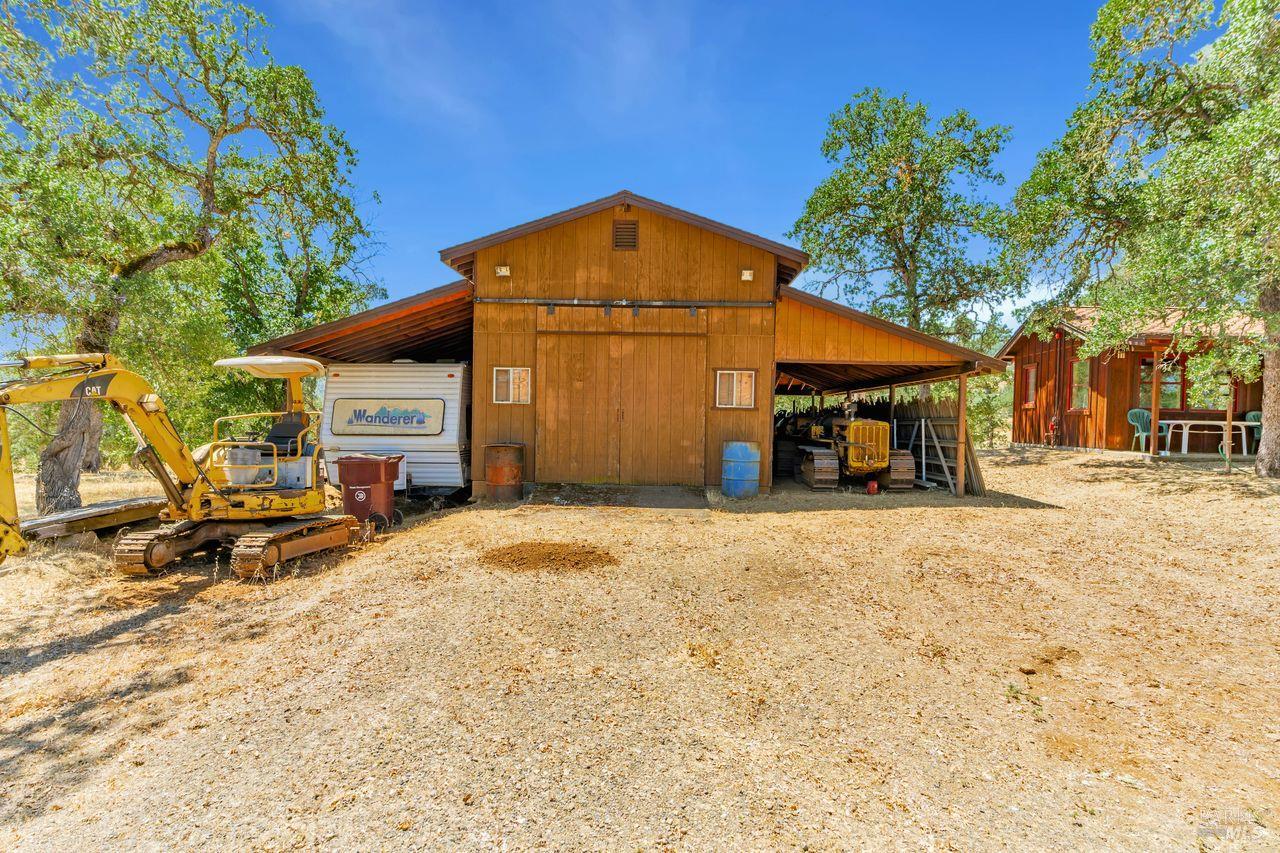 17277 Butts Canyon Road Middletown, CA 95461 - Photo 16 of 41 a front view of a house with a yard