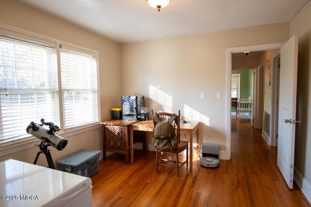 3160 Walden Road Macon, GA 31216 - Photo 17 of 32 a living room with furniture a wooden floor and a large window