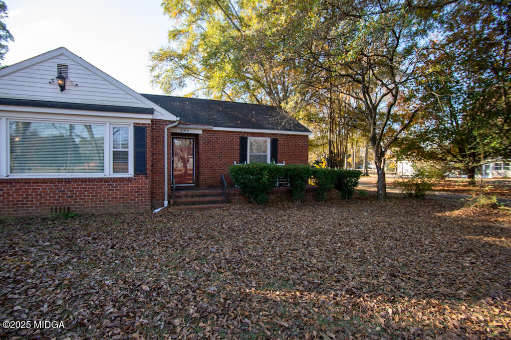 3160 Walden Road Macon, GA 31216 - Photo 27 of 32 a front view of a house with garden