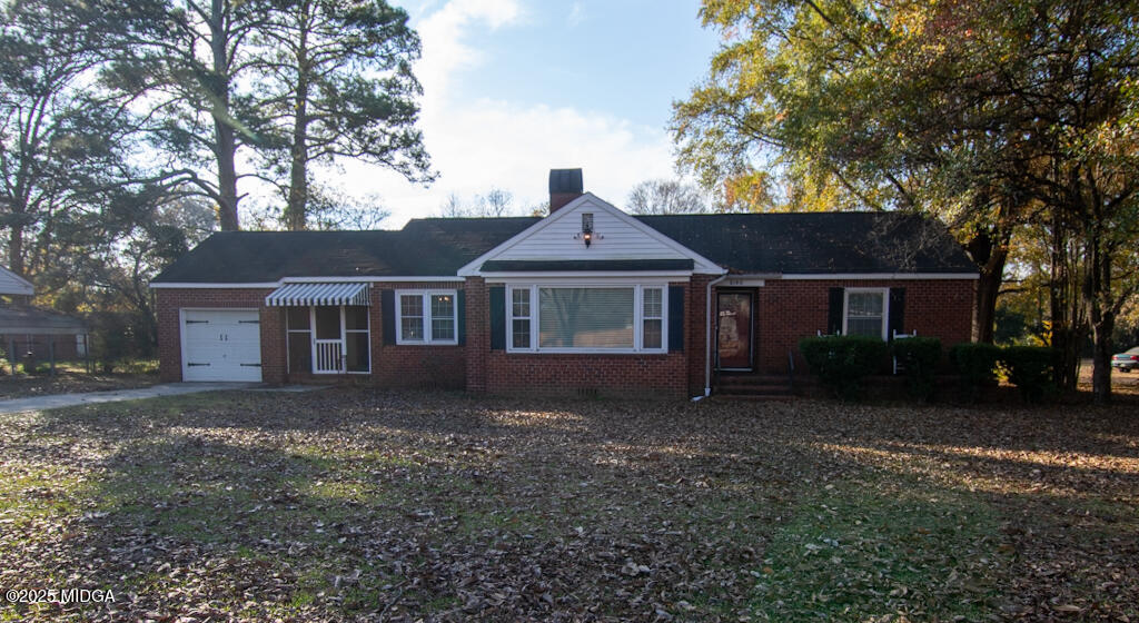 3160 Walden Road Macon, GA 31216 - Photo 31 of 32 a front view of a house with a garden