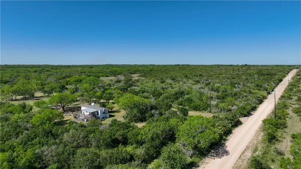 an aerial view of a house with yard and outdoor space