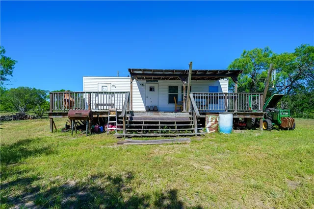 a view of backyard with green space
