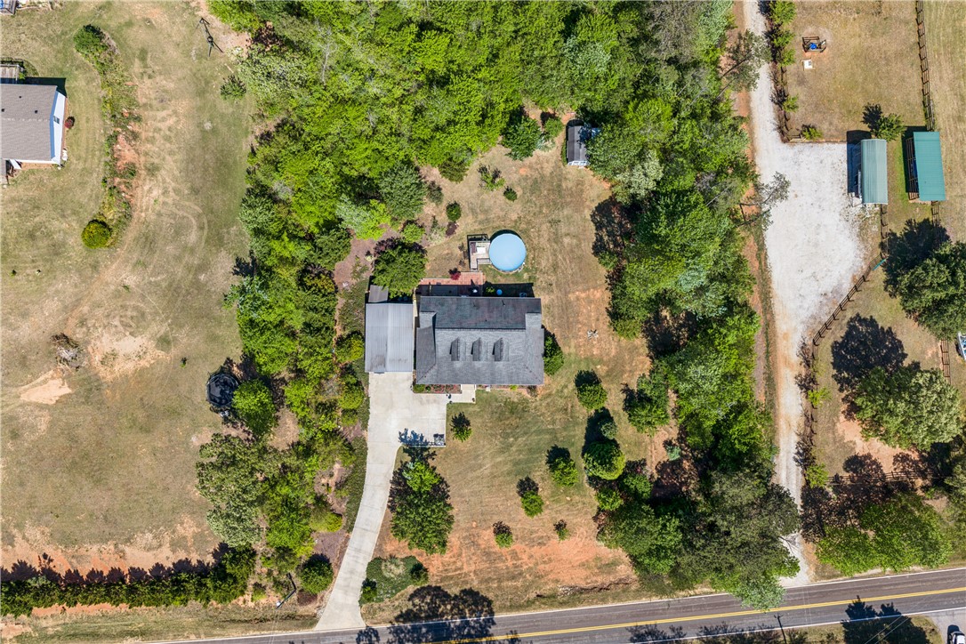 189 Little Choestoea Road Westminster, SC 29693 - Photo 3 of 38 This aerial view showcases a peaceful residence with ample outdoor space and a refreshing pool.