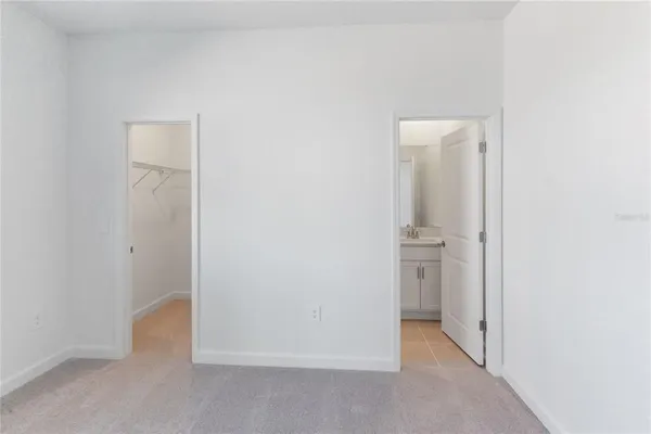 a view of an empty room and a window