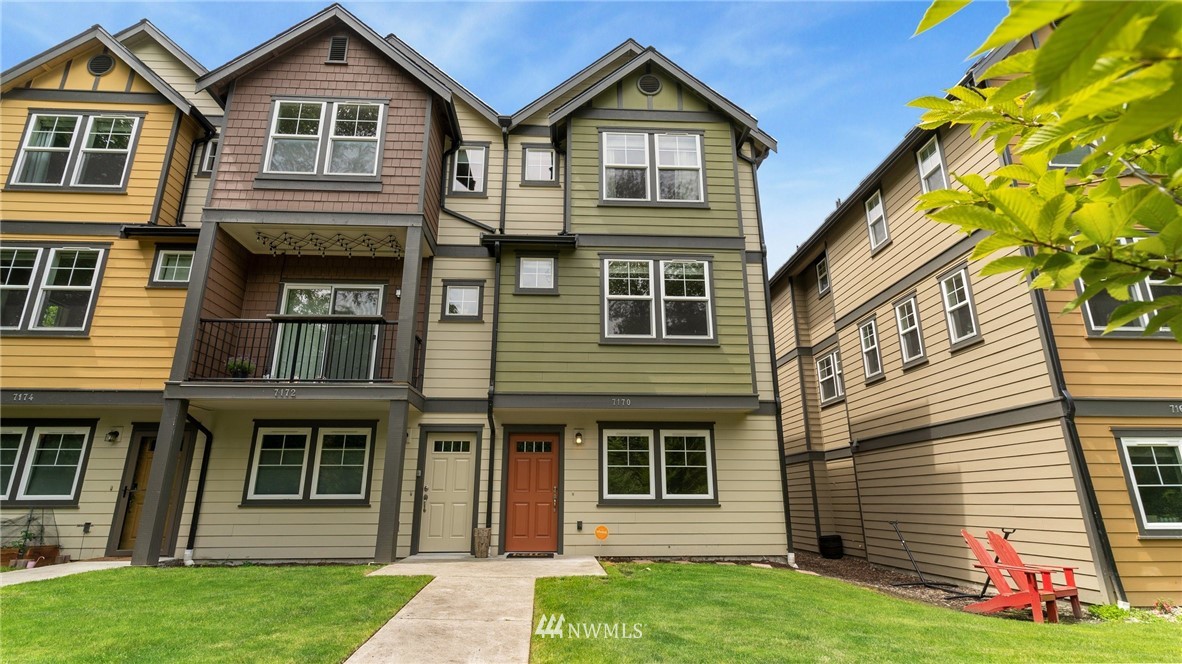 7170 Shinkle Place Southwest Seattle, WA 98106 - Photo 2 of 29 a front view of a house with garden