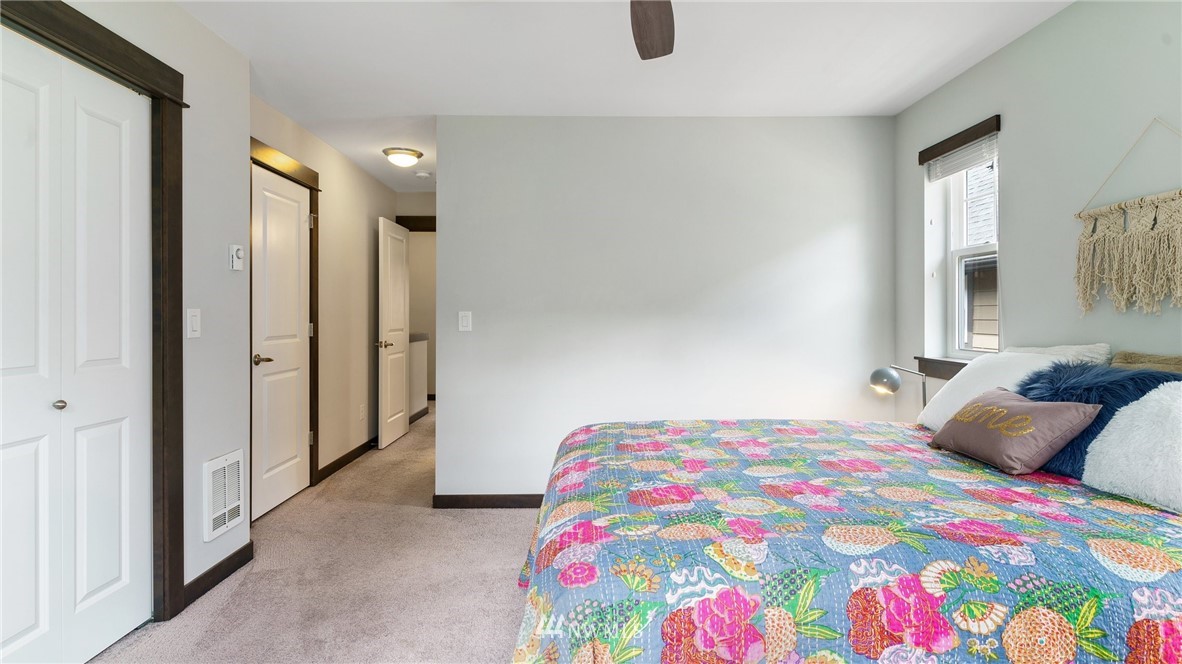 7170 Shinkle Place Southwest Seattle, WA 98106 - Photo 19 of 29 a bedroom with a bed and window
