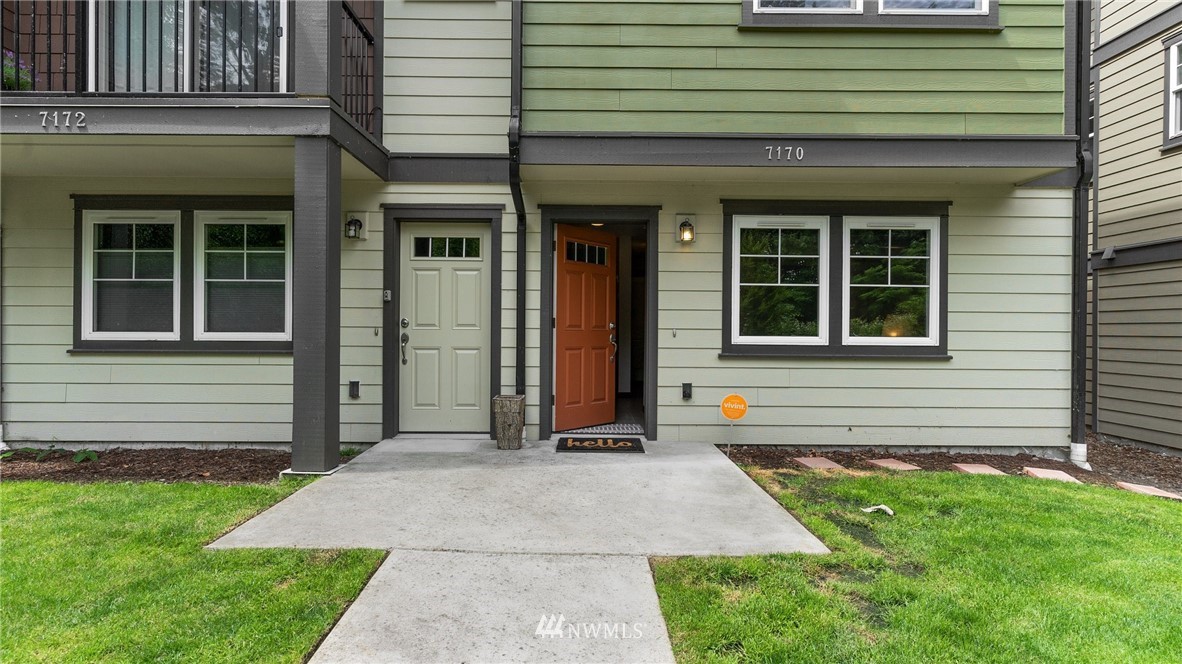 7170 Shinkle Place Southwest Seattle, WA 98106 - Photo 3 of 29 a front view of a house with a yard