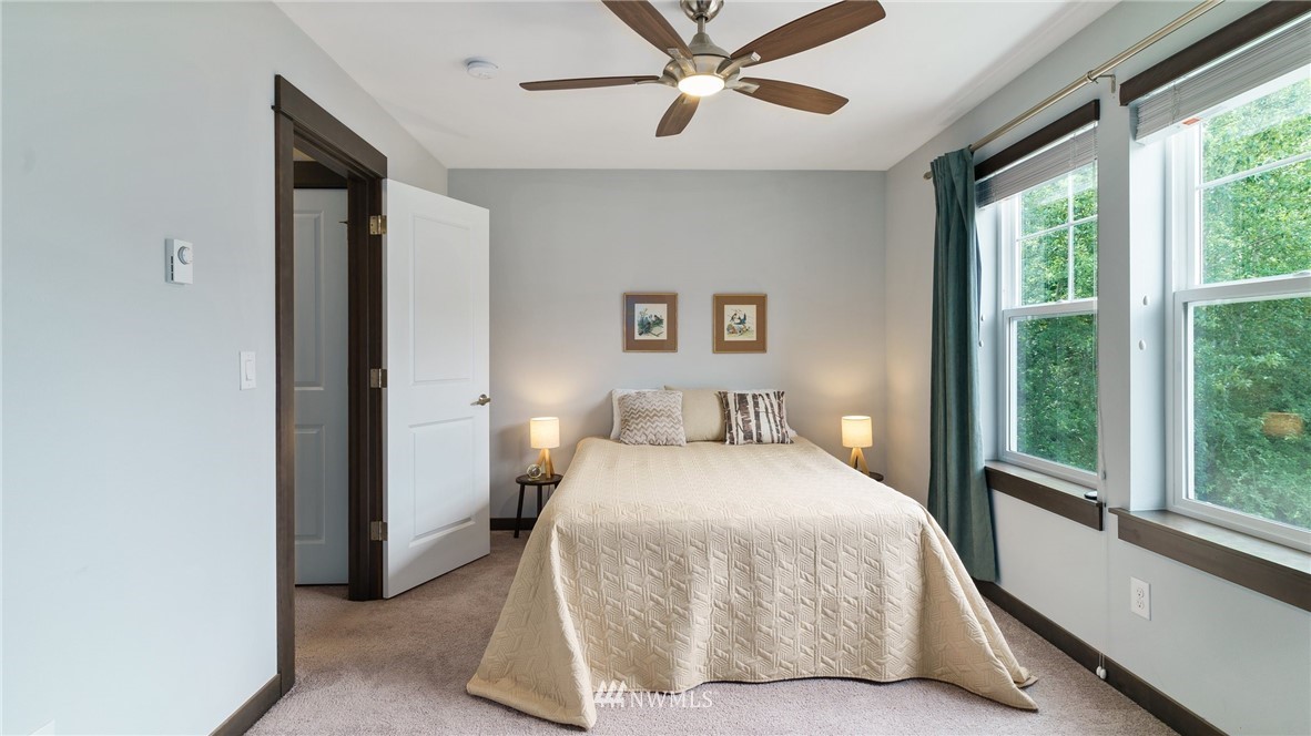 7170 Shinkle Place Southwest Seattle, WA 98106 - Photo 23 of 29 a bedroom with a bed and a large window