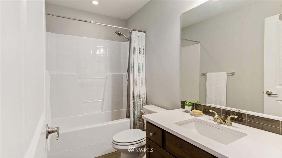 7170 Shinkle Place Southwest Seattle, WA 98106 - Photo 24 of 29 a bathroom with a sink toilet tub and shower