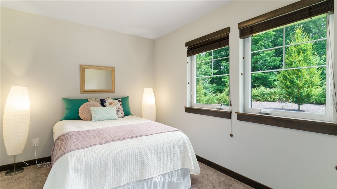 7170 Shinkle Place Southwest Seattle, WA 98106 - Photo 4 of 29 a bedroom with a bed and a window