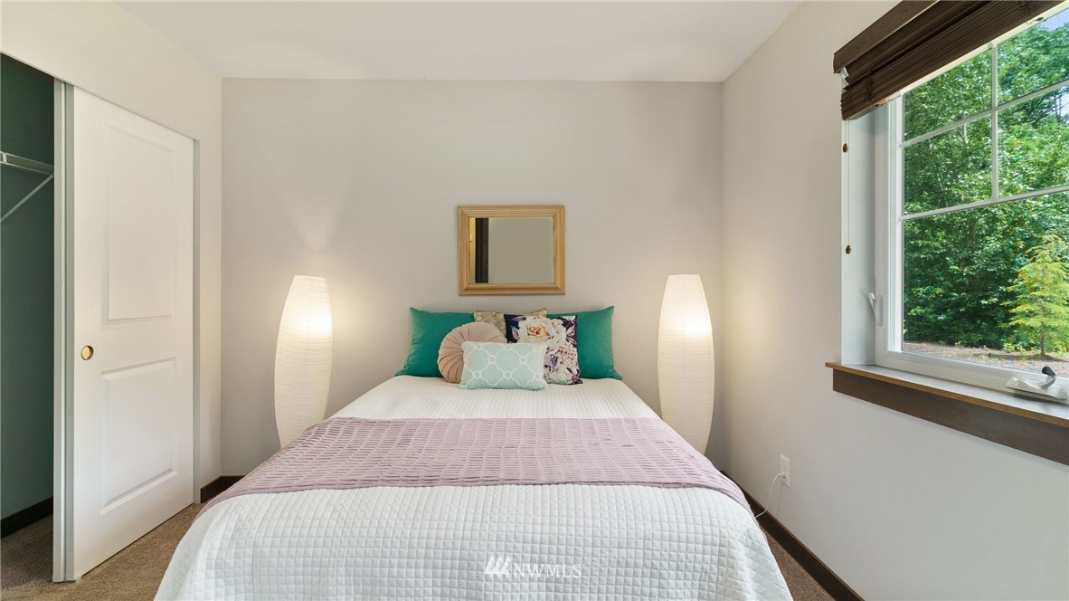 7170 Shinkle Place Southwest Seattle, WA 98106 - Photo 5 of 29 a bedroom with a bed and a window