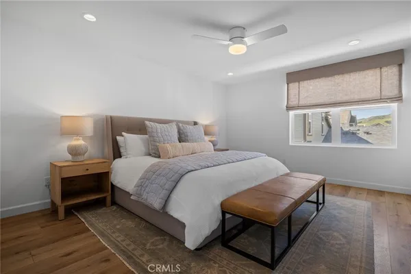 a bedroom with a bed and a lamp