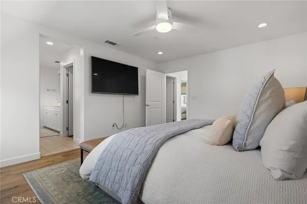 a bedroom with a bed and a cabinets