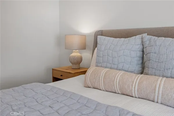 a bedroom with a bed and cabinets